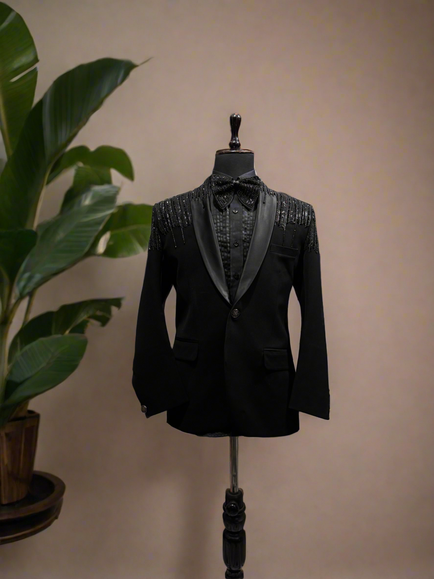 A model in a black formal suit, designed to make a statement at any special occasion.

