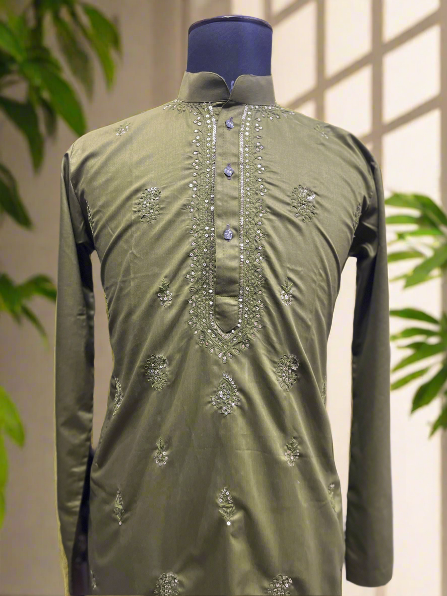 Designer kurta with embellishments in rich green hue.