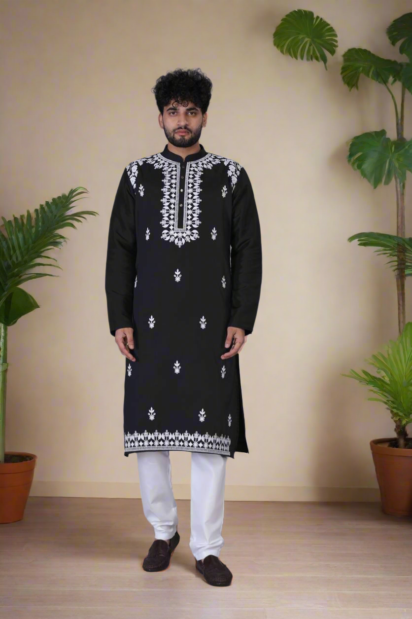Close-up of stylish embroidery on the black silk kurta.