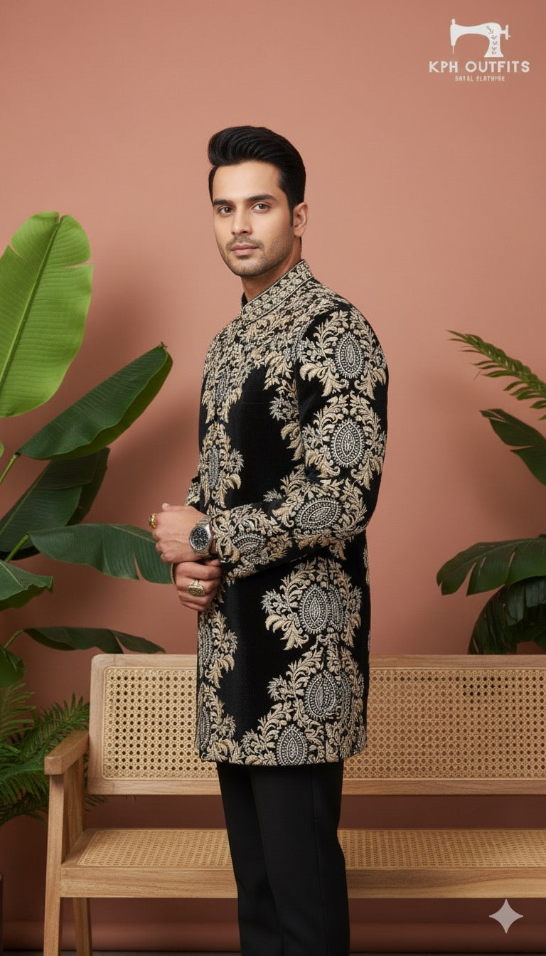 Designer black Achkan with dense, baroque-style gold work for a celebrity style.