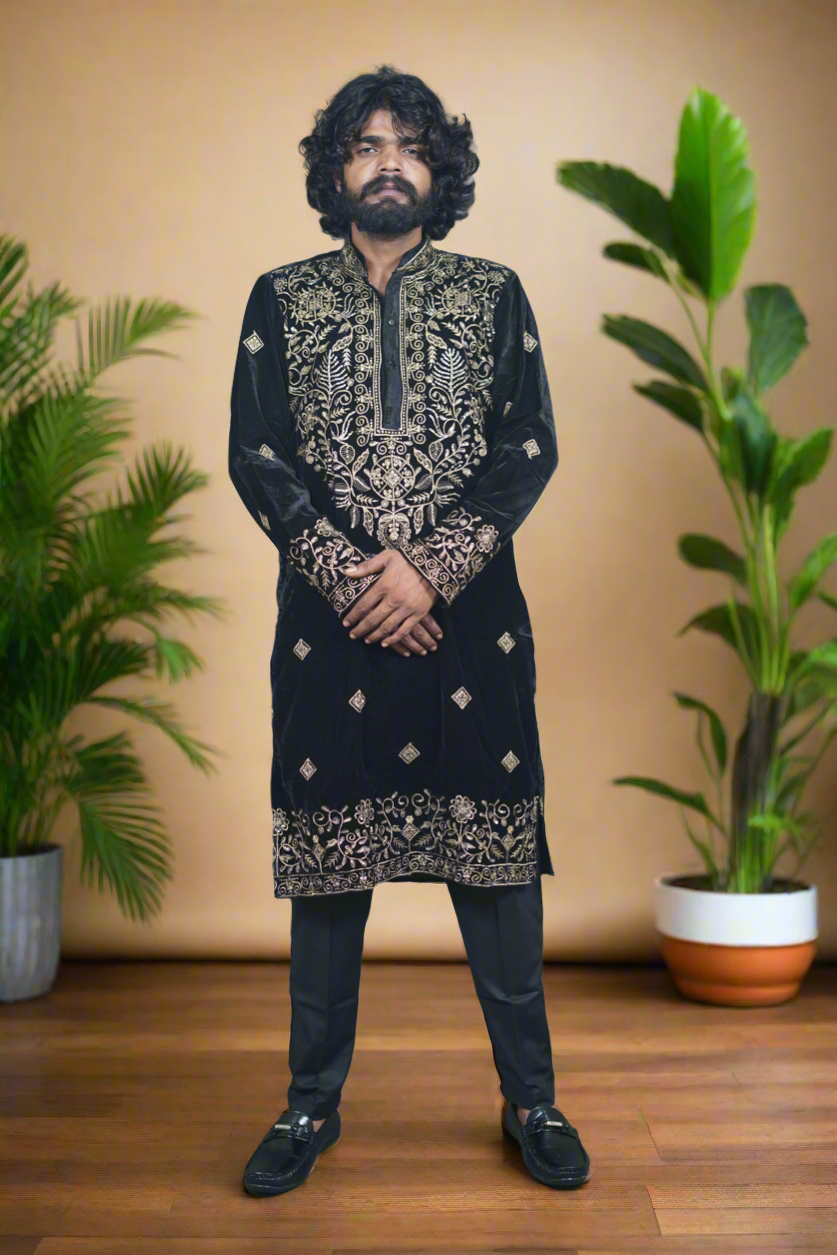 "Stylish men's kurta in black with golden threadwork, a premium ethnic wear choice for special events."
