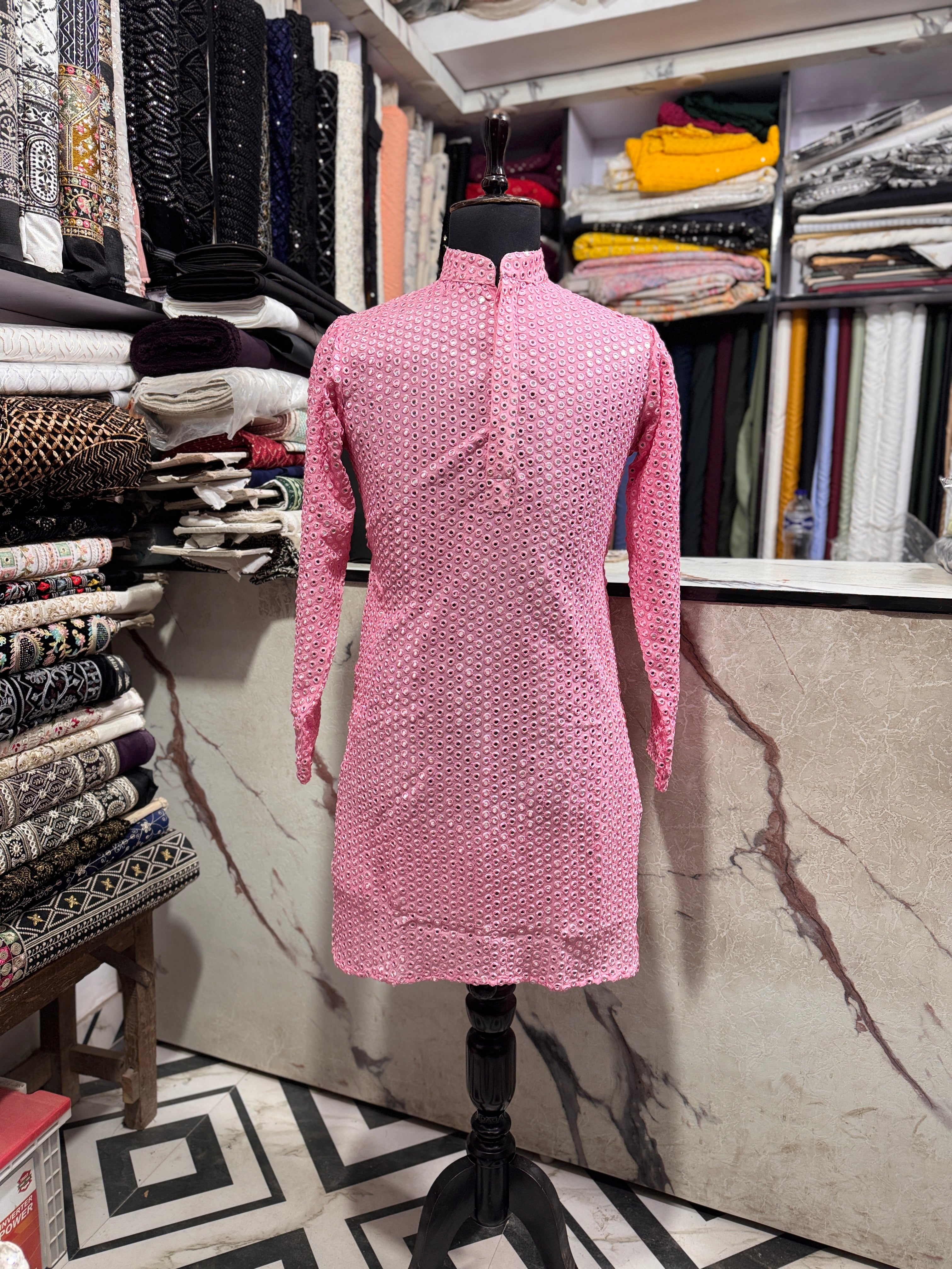 A full-length shot of the kurta set with the pants, highlighting the complete look.

