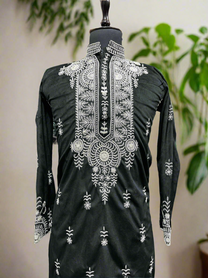 Modern men's black kurta with beads and stylish design.
