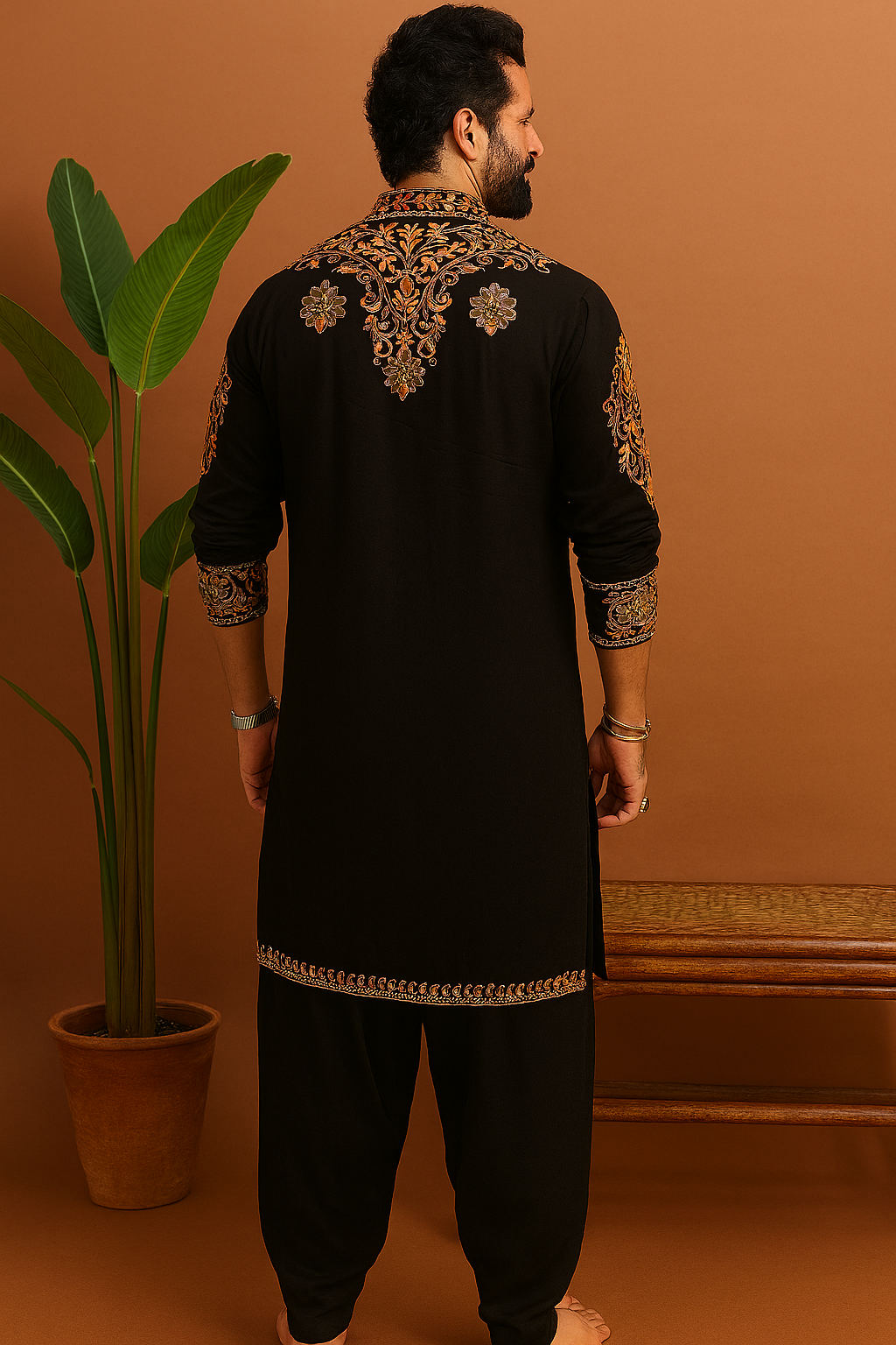 Back view of Celebrity Inspired Designer Embellished Kurta Set highlighting detailed gold work on premium fabric