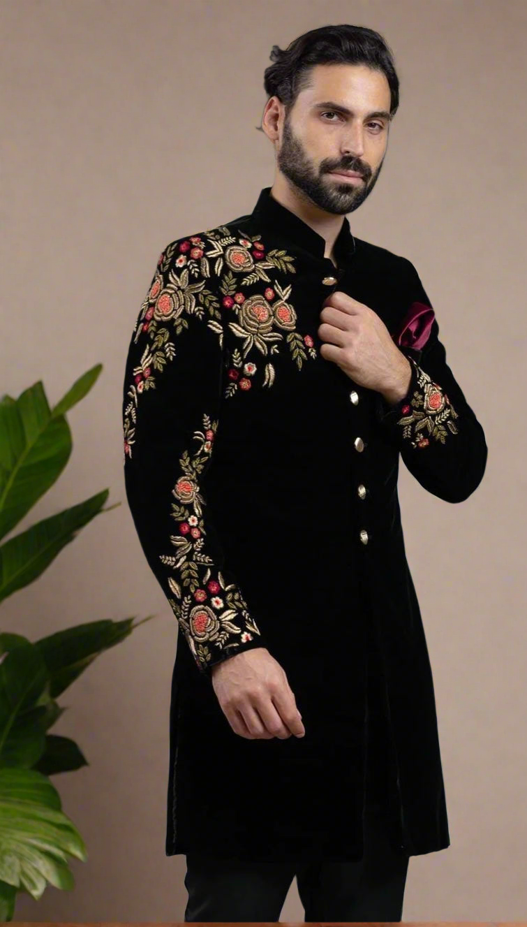 Black sherwani with machine-crafted embellishments.