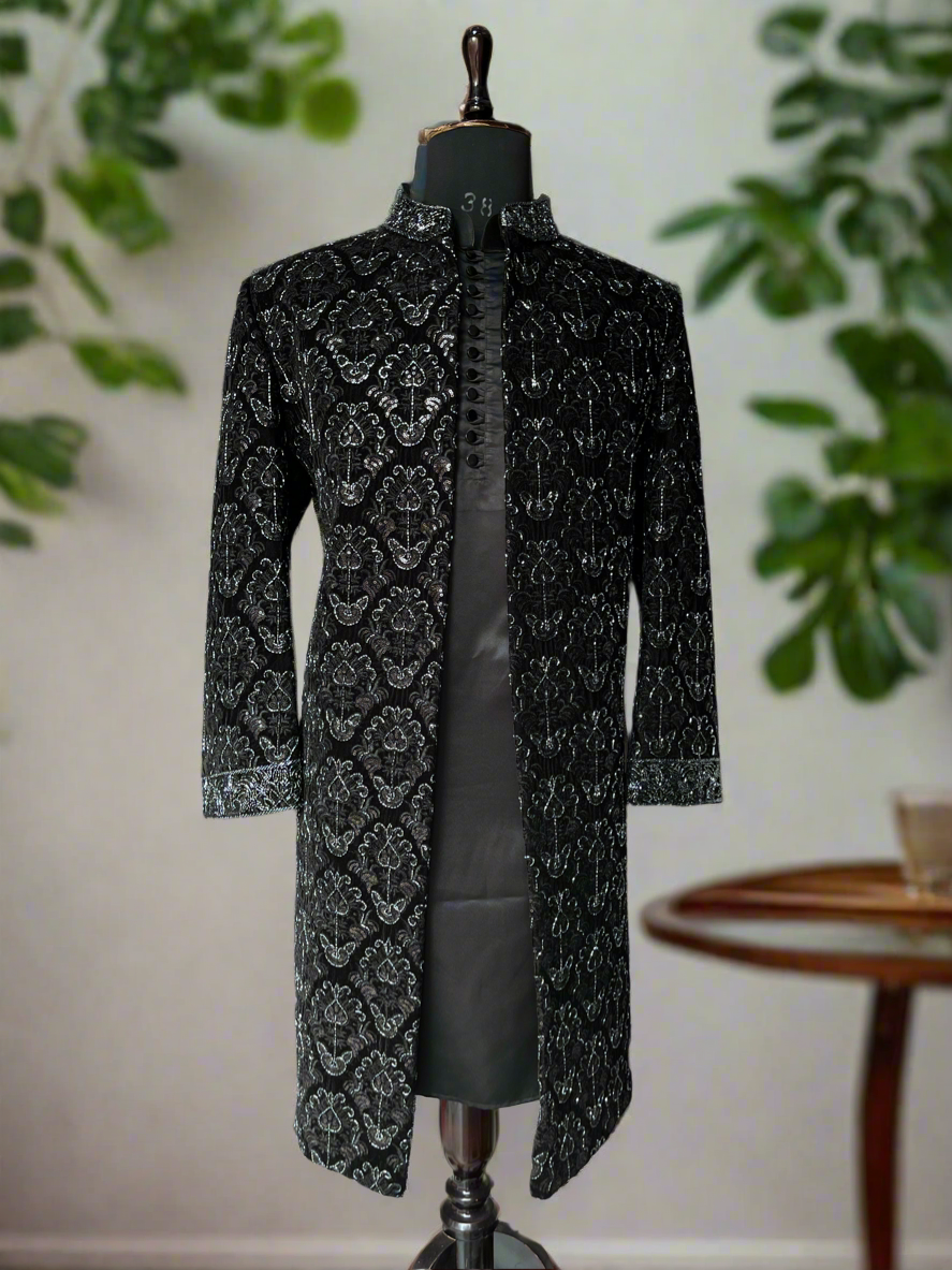 Black velvet designer outfit with intricate hand embroidery details