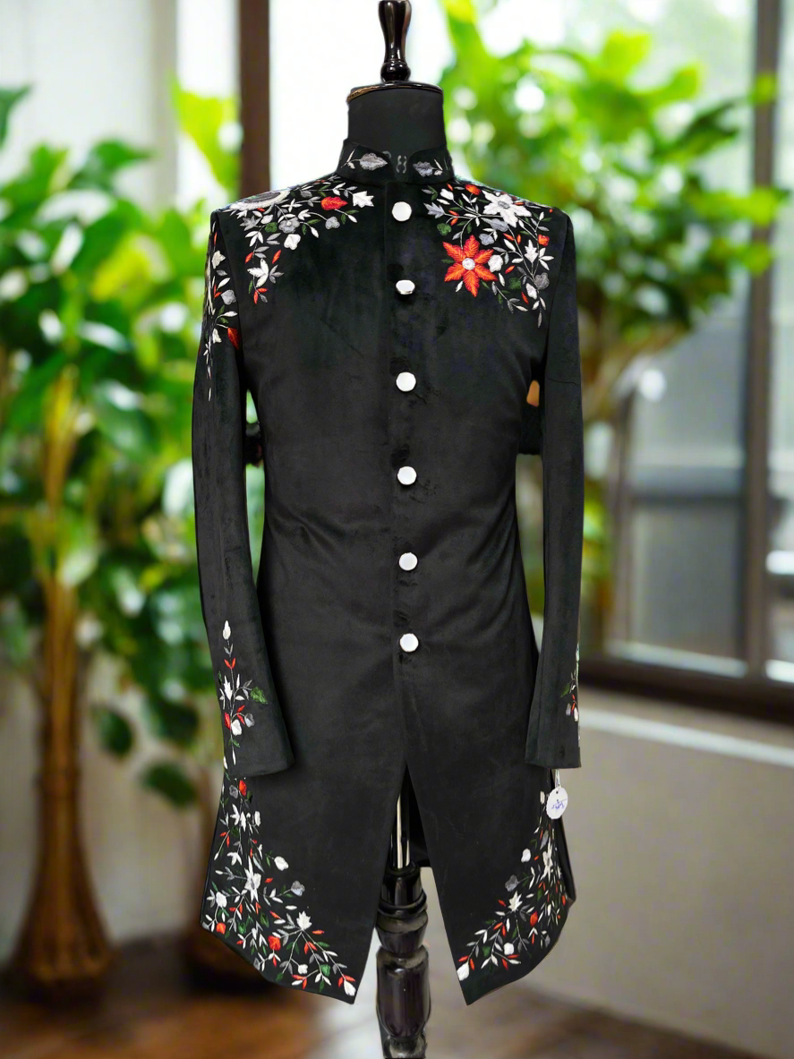 Black velvet sherwani with intricate thread embroidery.