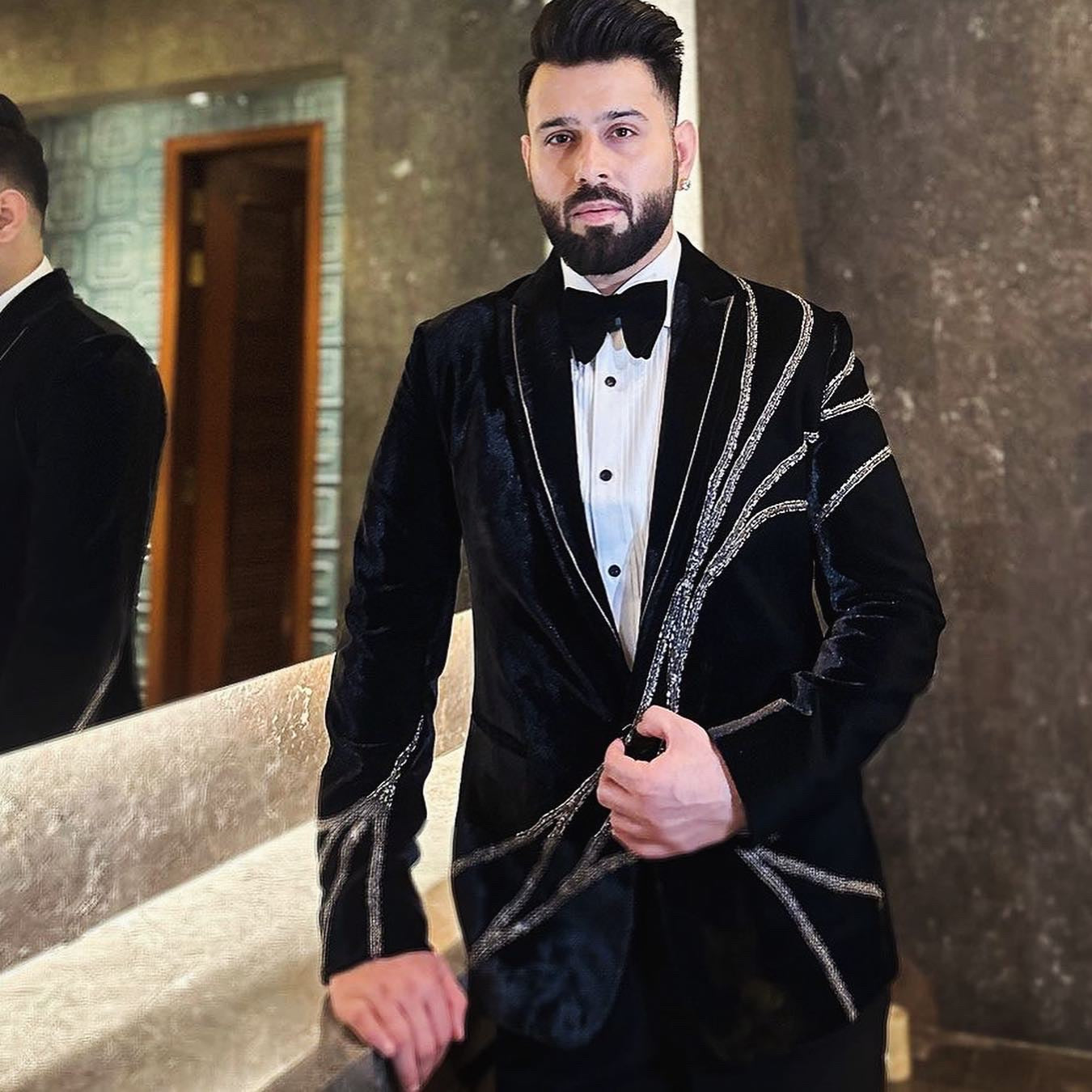 Black velvet tuxedo with silver Zardozi work
