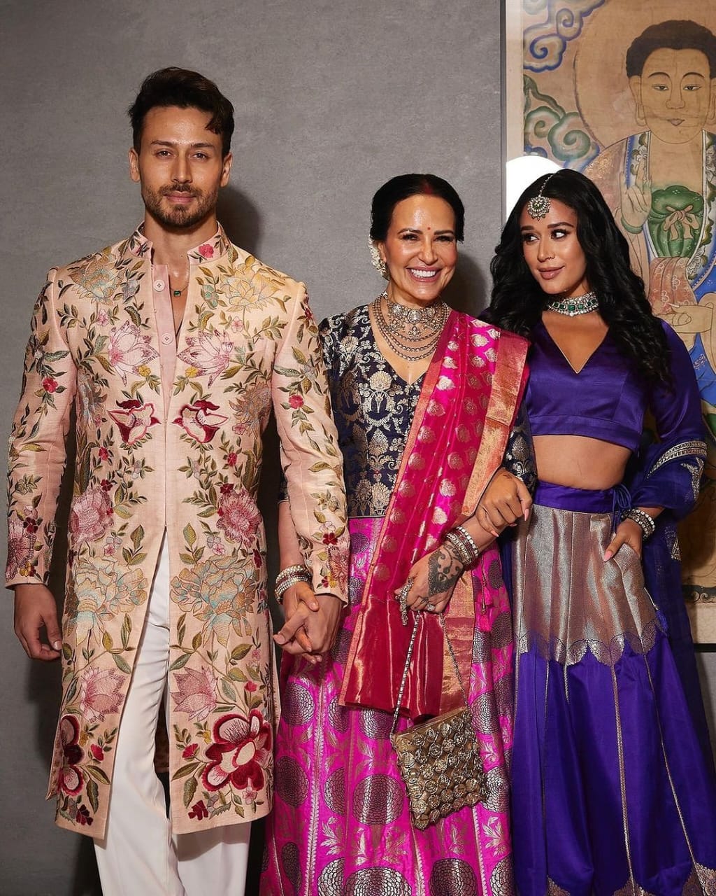 Bollywood-inspired embroidered sherwani for grooms.
