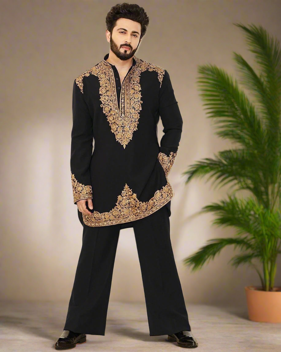 Close-up of detailed zardozi work on the black kurta.