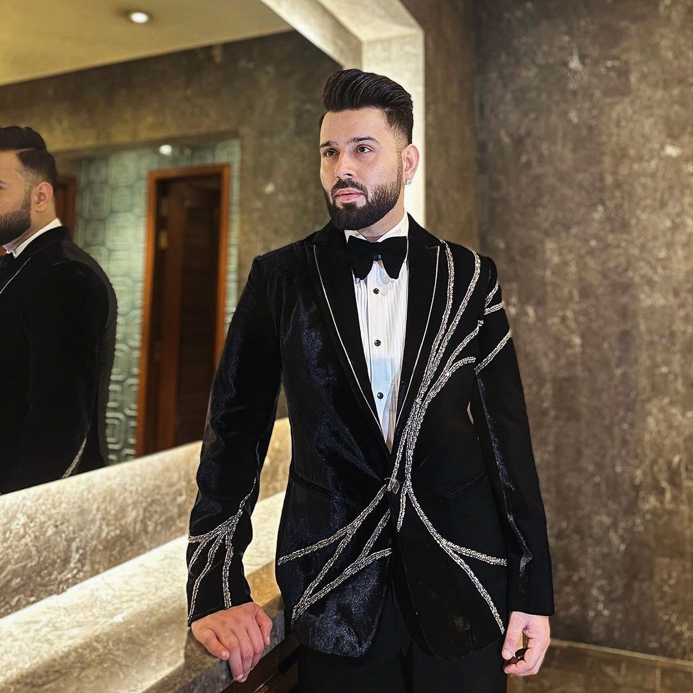 Close-up of silver Zardozi detailing on tuxedo
