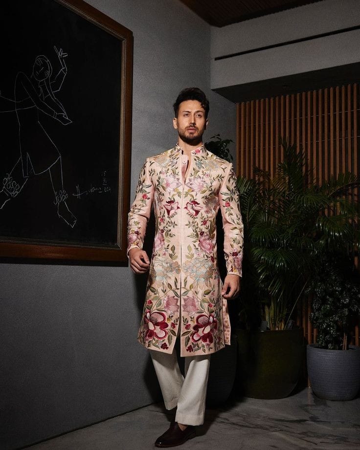 Designer wedding sherwani with vibrant patterns for men.
