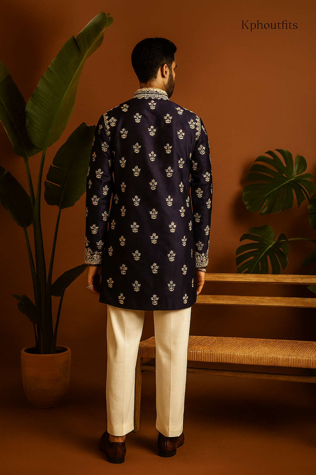 A model in a dark maroon formal kurta set, designed to make a statement at any special occasion.

