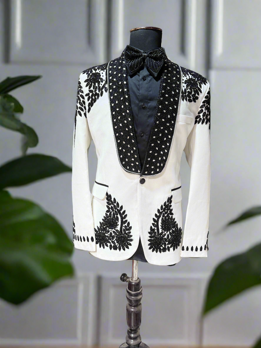 Elegant ivory tuxedo for grooms designed by KPH Outfits
