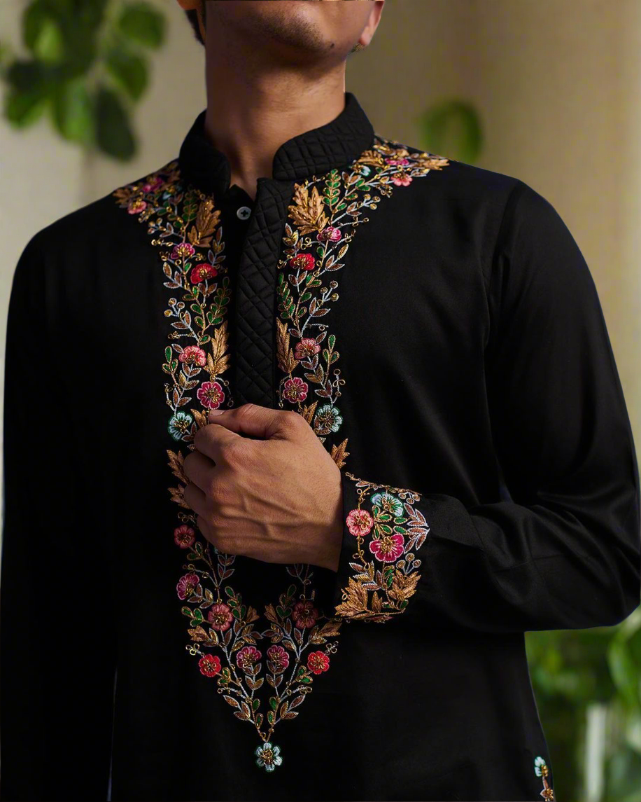 Close-up of vibrant embroidery on the black short kurta
