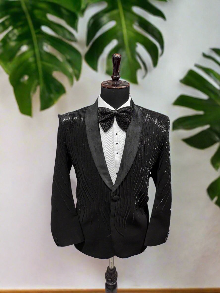 A photograph of a man in a stylish tuxedo, emphasizing the quality of the Japanese fabric and the overall craftsmanship.

