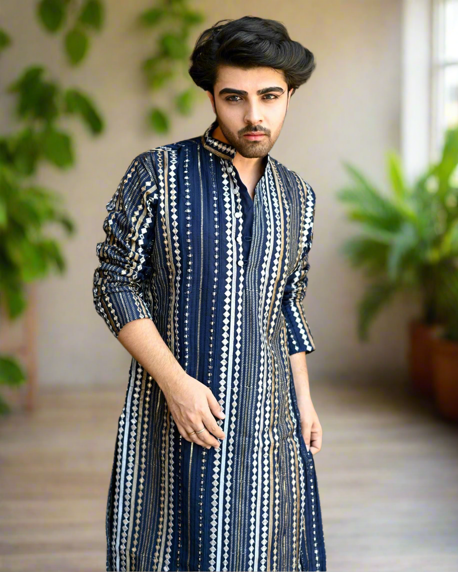 Men's navy blue mirror work kurta set with intricate detailing.