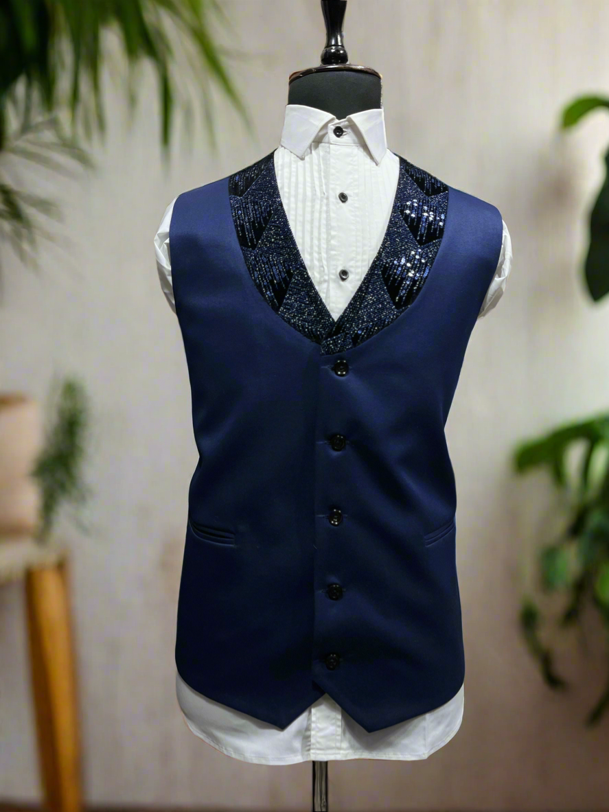 Front view of navy tuxedo with broad lapel.
