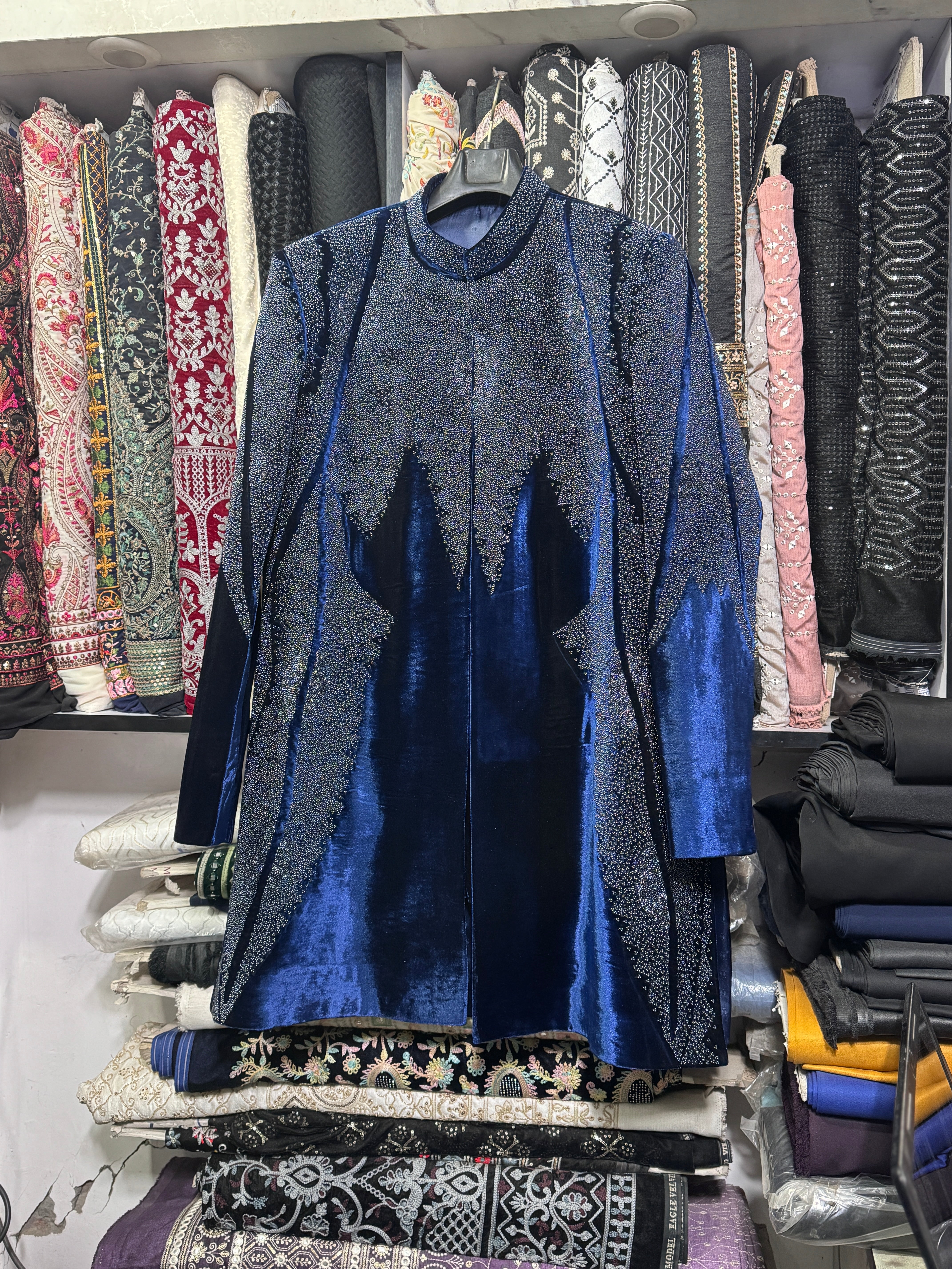 Groom wearing Black Velvet Sherwani with bead detailing