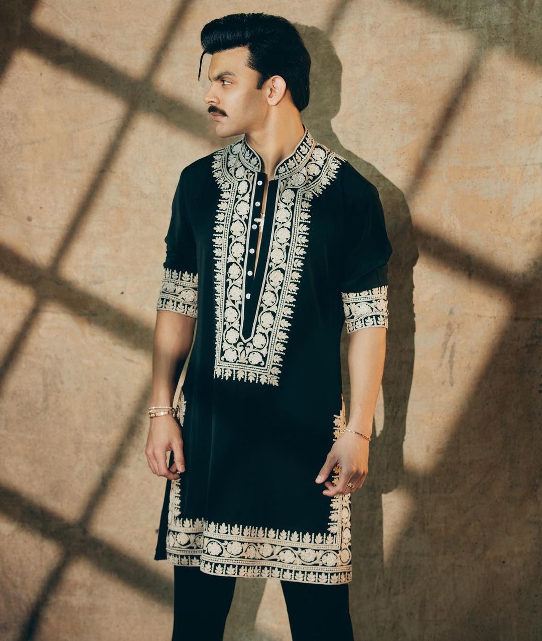 Luxurious black velvet kurta set for weddings and celebrations.