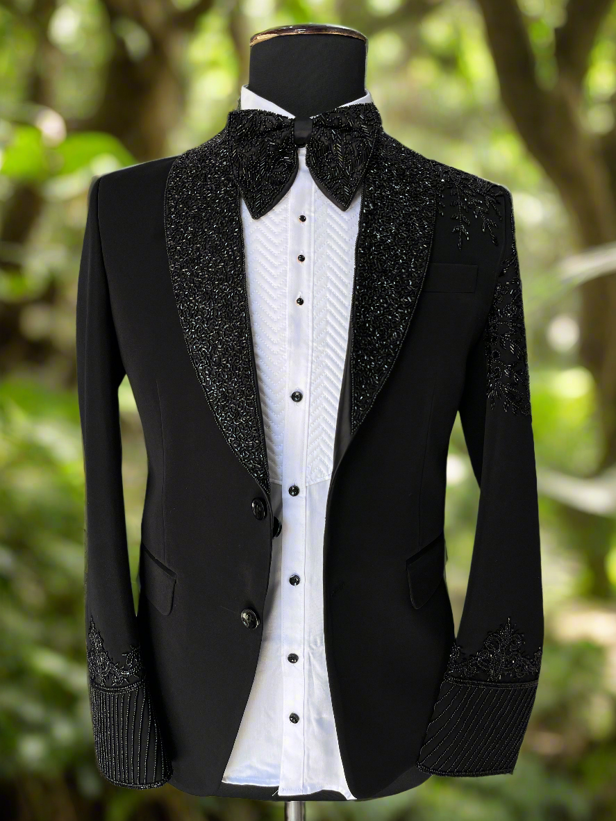 Men's black handcrafted tuxedo suit with cut work design
