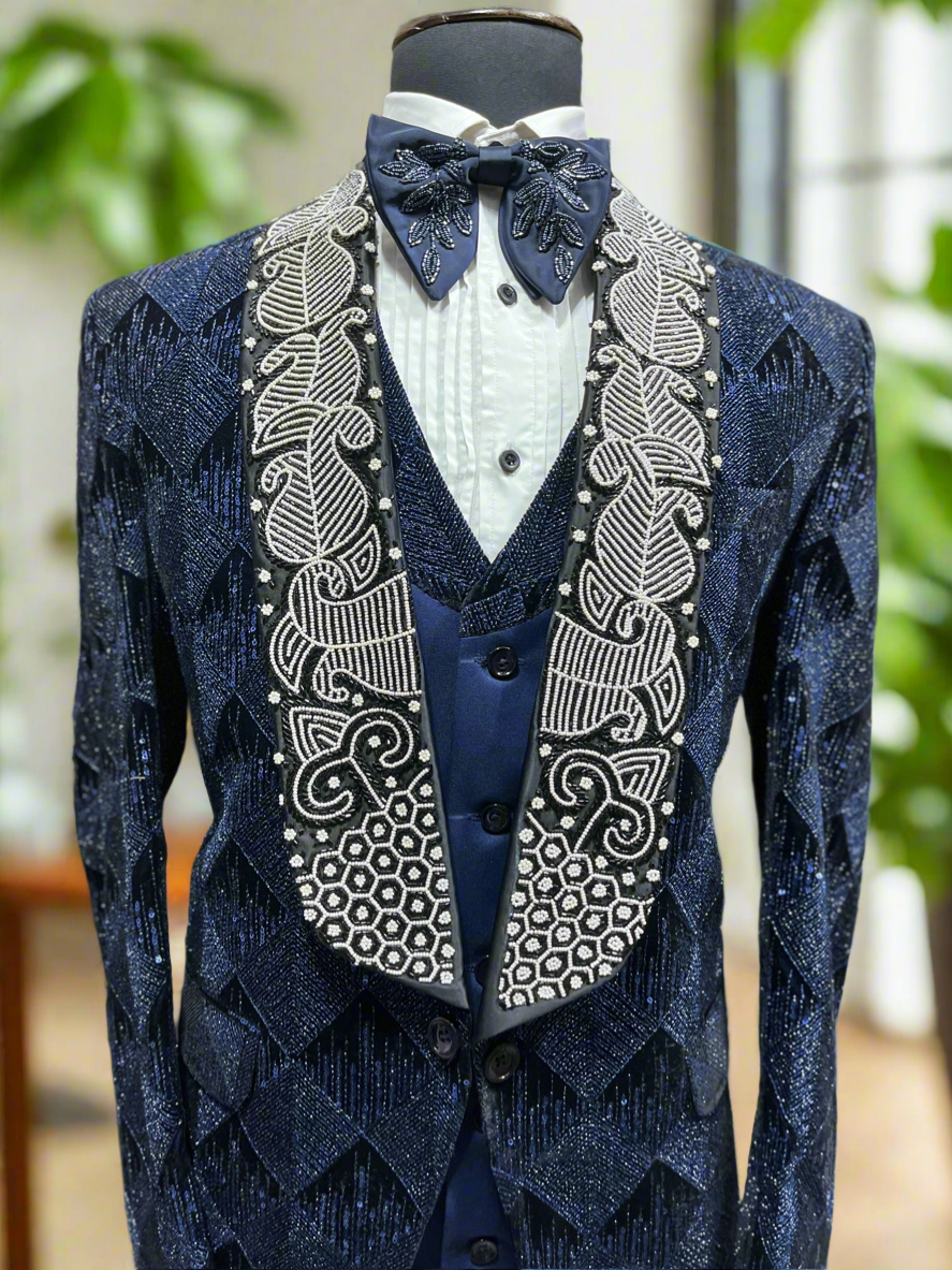 Men's elegant handcrafted navy tuxedo for formal events.
