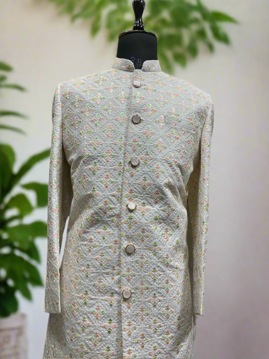 Modern off-white sherwani set with zipper-style pants
