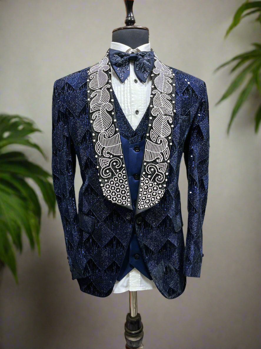 Navy blue tuxedo suit with broad shawl lapel design.