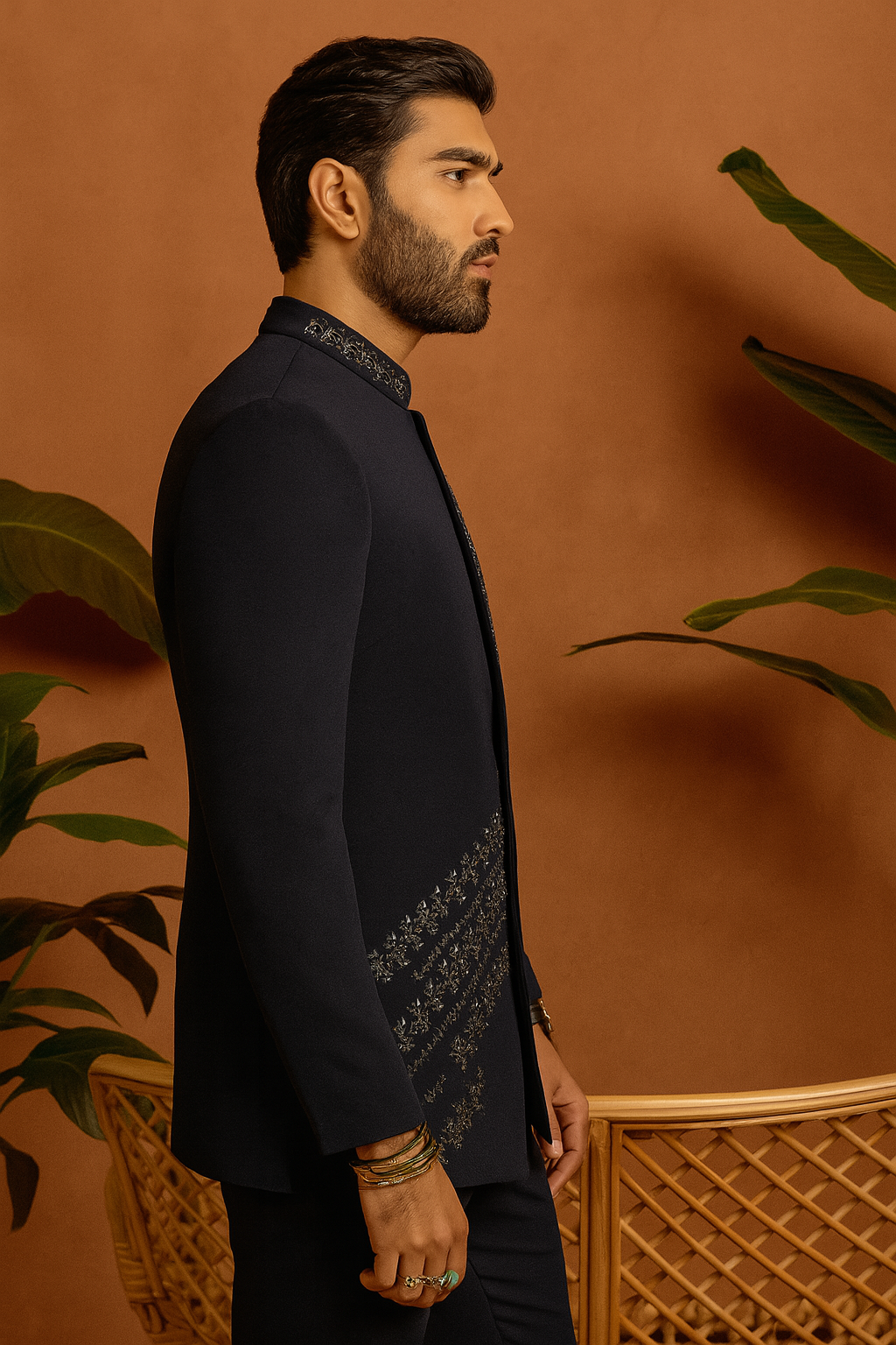 Side profile close-up of cut work detailing on navy Jodhpuri jacket