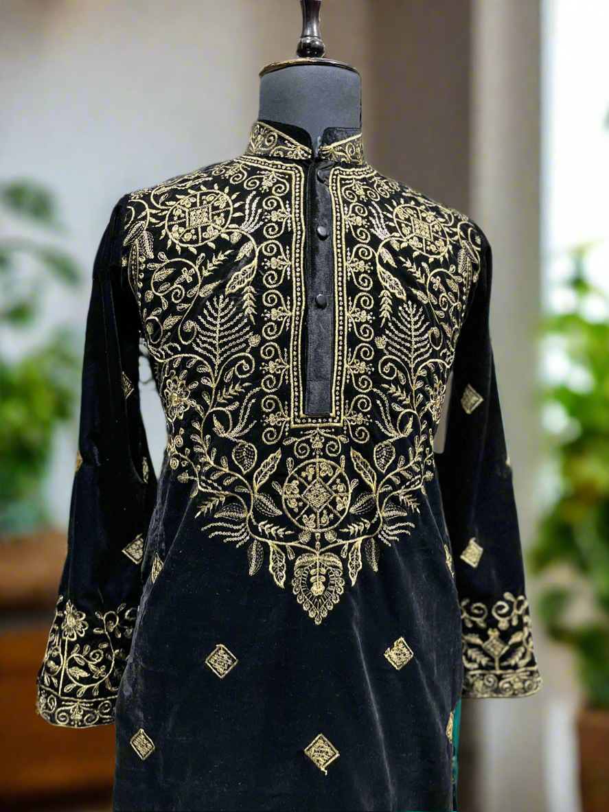 Full view of the embroidered kurta paired with sleek pants.