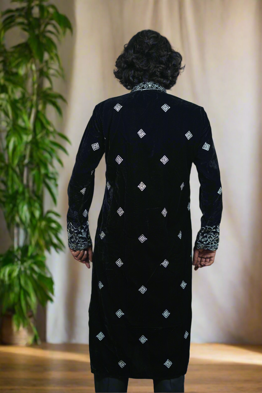 Designer black kurta set with luxurious silver embroidery for special occasions.
